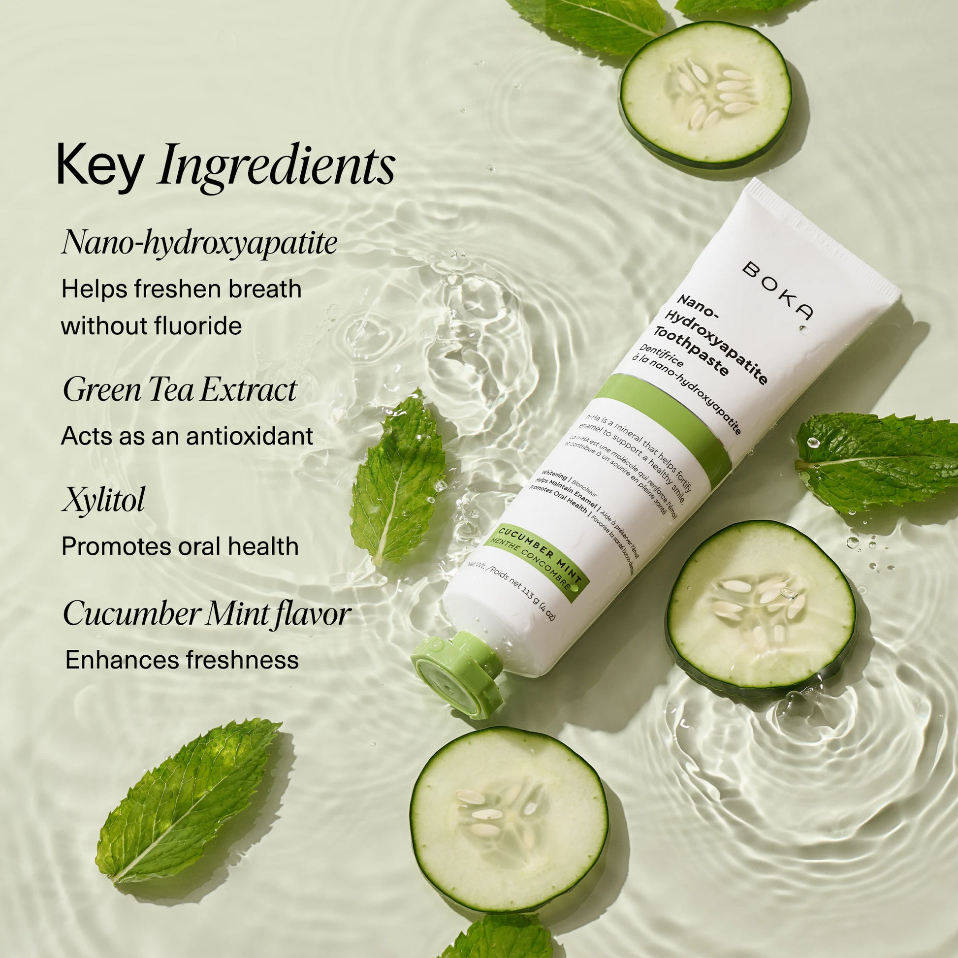 Cucumber Mint n-Ha Toothpaste tube with cucumber, mint, and ingredients on rippled water.