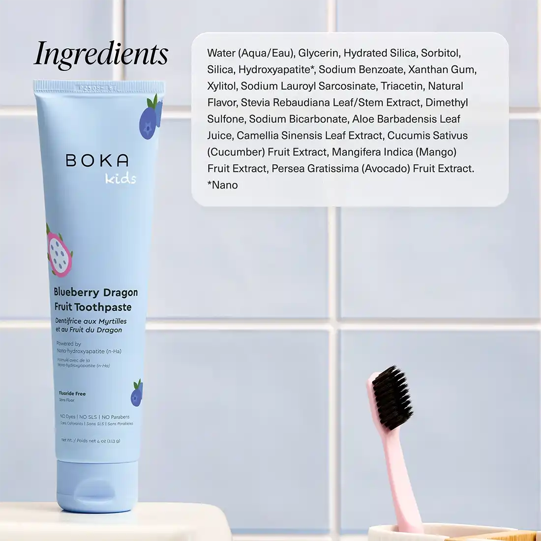 Boka Kids Blueberry Dragon Fruit Toothpaste with ingredients list on a tiled bathroom wall background