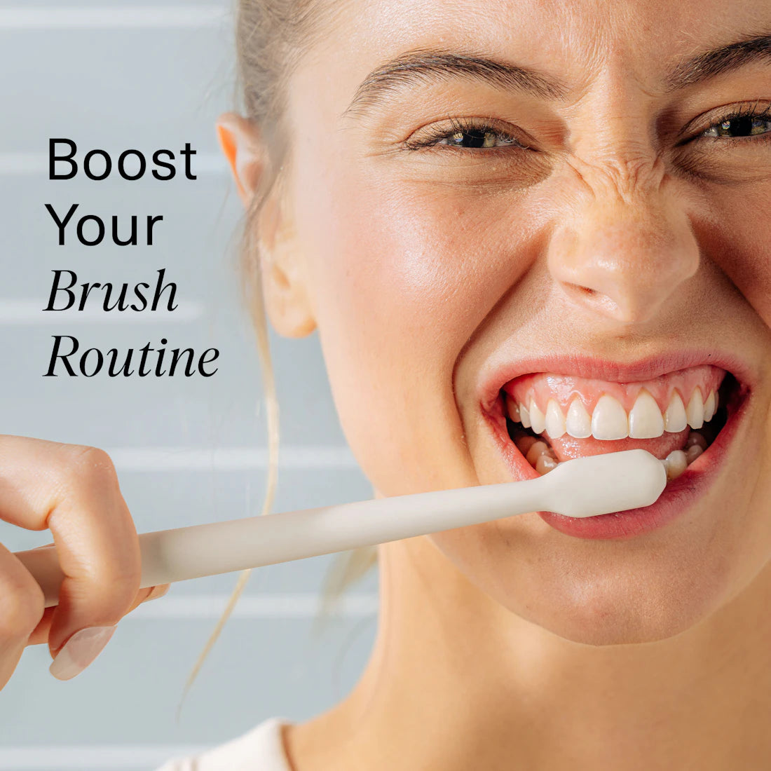 Person brushing teeth with a toothbrush, text 'Boost Your Brush Routine' on a light blue background