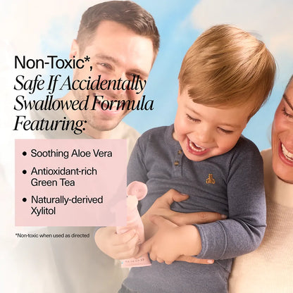 Child holding Boka toothpaste with parents, featuring text about formula ingredients.