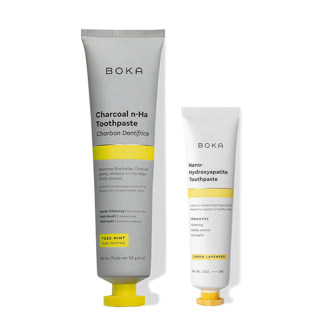 Two Home & Away Boka toothpastes with yellow caps, designed to remineralize and strengthen enamel.