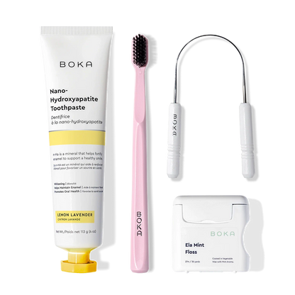 Boka Starter Kit: nano-hydroxyapatite toothpaste, pink toothbrush, tongue cleaner, and floss.