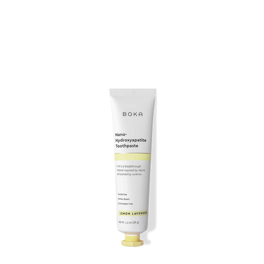 A white tube of Lemon Lavender Travel Size n-Ha Toothpaste on a black background.