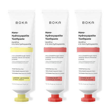Three tubes of Boka Nano-Hydroxyapatite Toothpaste with different flavors on a white background.