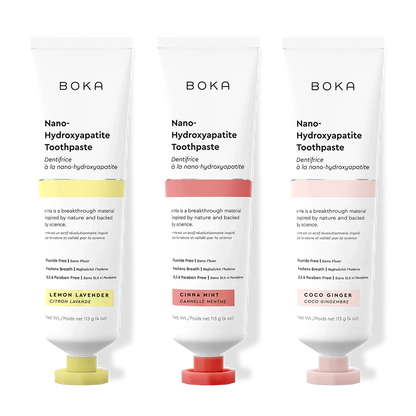 Three tubes of Boka Nano-Hydroxyapatite Toothpaste with different flavors on a white background.