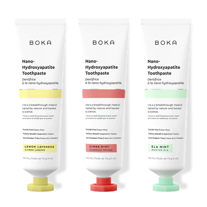 Three tubes of Boka Nano-Hydroxyapatite Toothpaste with different flavors on a white background.