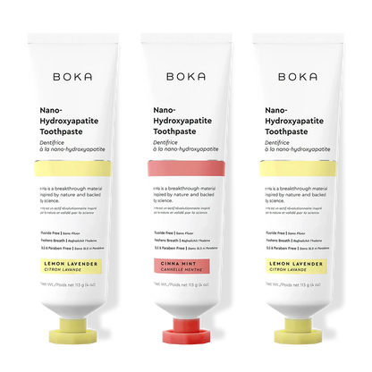 Three tubes of Boka Nano-Hydroxyapatite Toothpaste with different flavors on a white background.