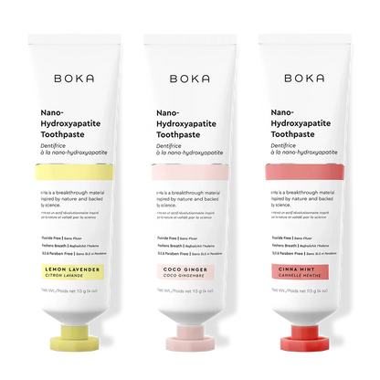 Three tubes of Boka Nano-Hydroxyapatite Toothpaste with different flavors on a white background.