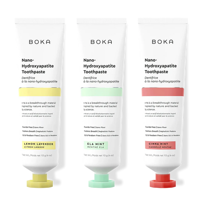 Three tubes of Boka Nano-Hydroxyapatite Toothpaste with different flavors on a white background.