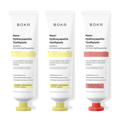 Three tubes of Boka Nano-Hydroxyapatite Toothpaste with different flavors on a white background.
