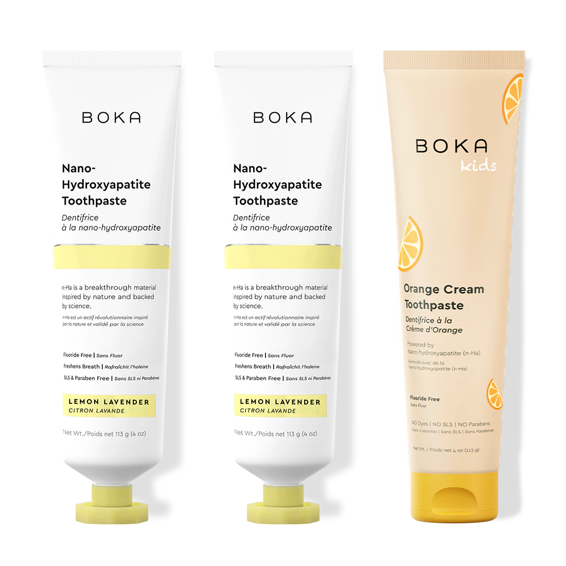 Two bottles of Boka Nano-Hydroxyapatite Toothpaste and a tube of Boka Kids Orange Cream Toothpaste on a white background.