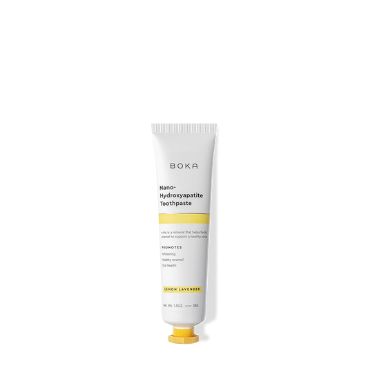 A white tube of Lemon Lavender Travel Size n-Ha Toothpaste to whiten and remineralize teeth.