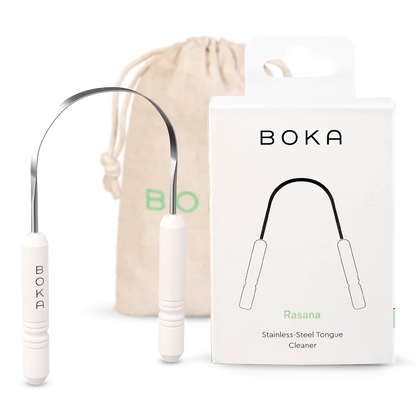 Boka stainless steel tongue cleaner with packaging and drawstring bag on a white background