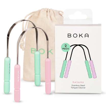 Boka stainless-steel tongue cleaners with packaging and drawstring bag on a white background