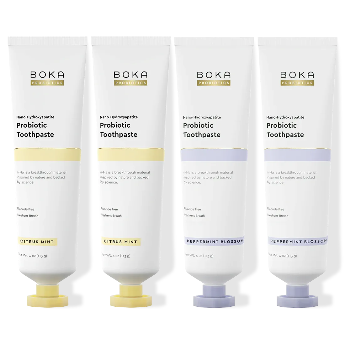 Four Boka Probiotic Toothpaste tubes in different flavors on a white background