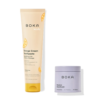 Boka Kids Orange Cream Toothpaste and Restore Mouthwash on a white background