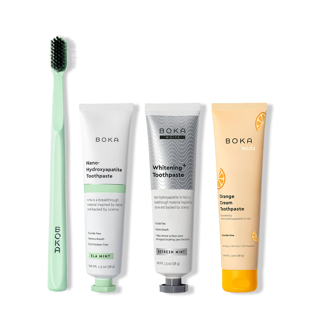 Collection of Boka toothpaste products including a toothbrush on a white background