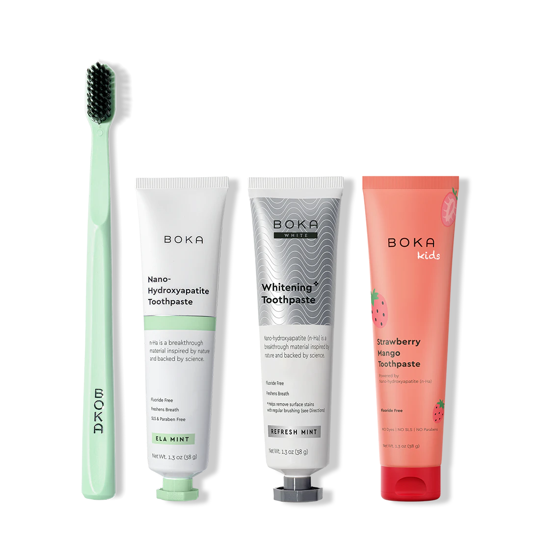 Collection of Boka toothpaste and a toothbrush on a white background