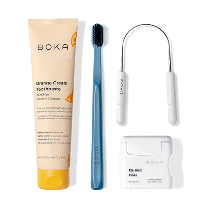 Starter Kit: toothpaste, blue charcoal-bristle toothbrush, floss, and a dental floss pick.