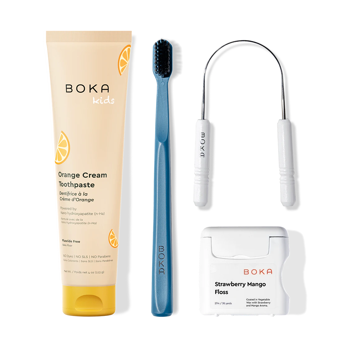 Boka dental care products including toothpaste, toothbrush, Tongue Scraper and floss on a white background