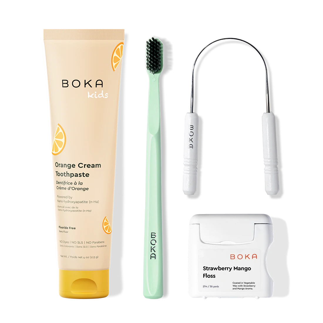 Boka dental care products including toothpaste, toothbrush, Tongue Scraper and floss on a white background