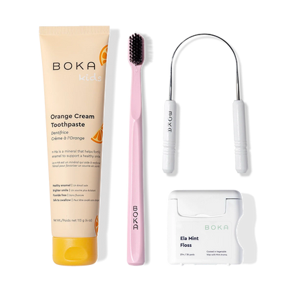 Starter Kit: toothpaste, pink charcoal-bristle toothbrush, tongue cleaner, and mint floss.
