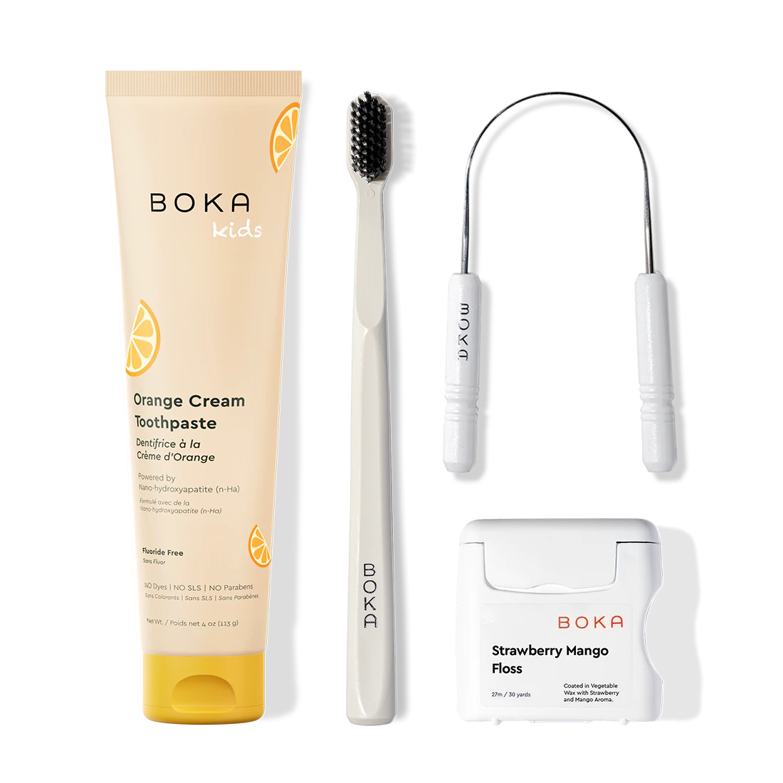 Boka dental care products including toothpaste, toothbrush, Tongue Scraper and floss on a white background
