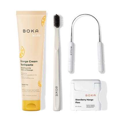 Boka dental care products including toothpaste, toothbrush, Tongue Scraper and floss on a white background
