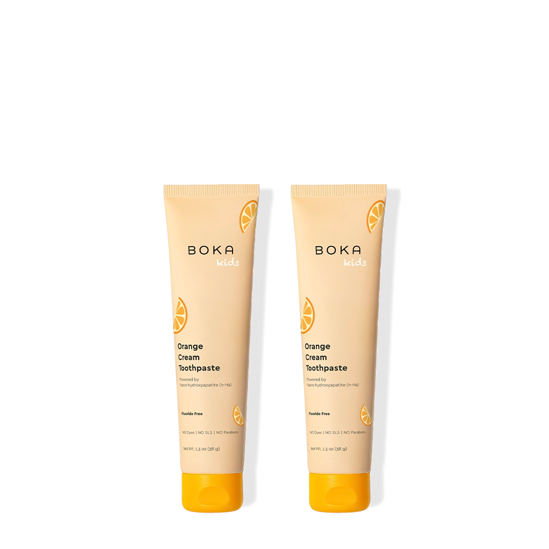 Two tubes of Boka Orange Cream Toothpaste on a white background