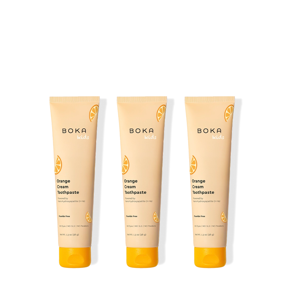 Three tubes of Boka Orange Cream Toothpaste on a white background