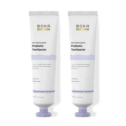 Two tubes of Boka Probiotic Toothpaste on a white background