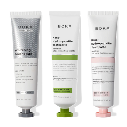 Three Nano (n-Ha) Toothpaste Whitening tubes stand upright, each with colored caps and flavors.