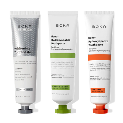 Three Nano (n-Ha) Toothpaste Whitening 3 Pack tubes upright on a black background.