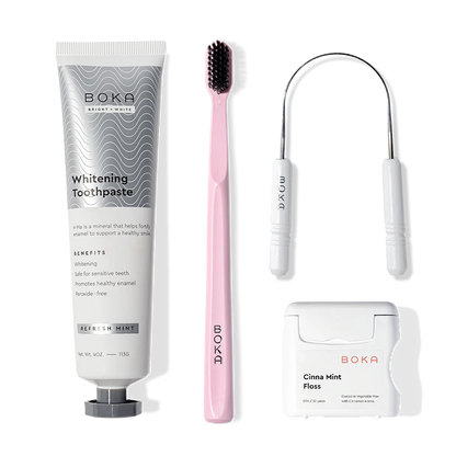 The Starter Kit includes toothpaste, a pink toothbrush, floss, and a pick for a neat oral care display.
