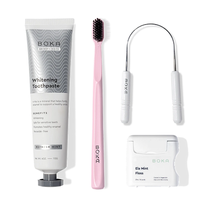 Starter Kit with nano-hydroxyapatite toothpaste, charcoal toothbrush, and mint floss on white.