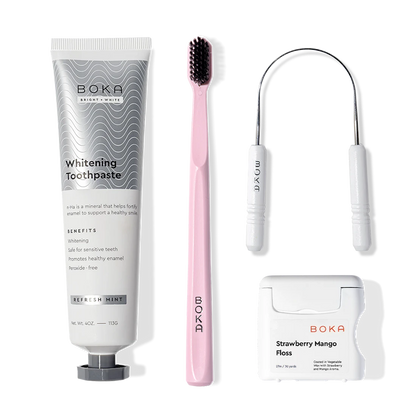The Starter Kit includes a pink charcoal toothbrush, floss, and nano-hydroxyapatite toothpaste.