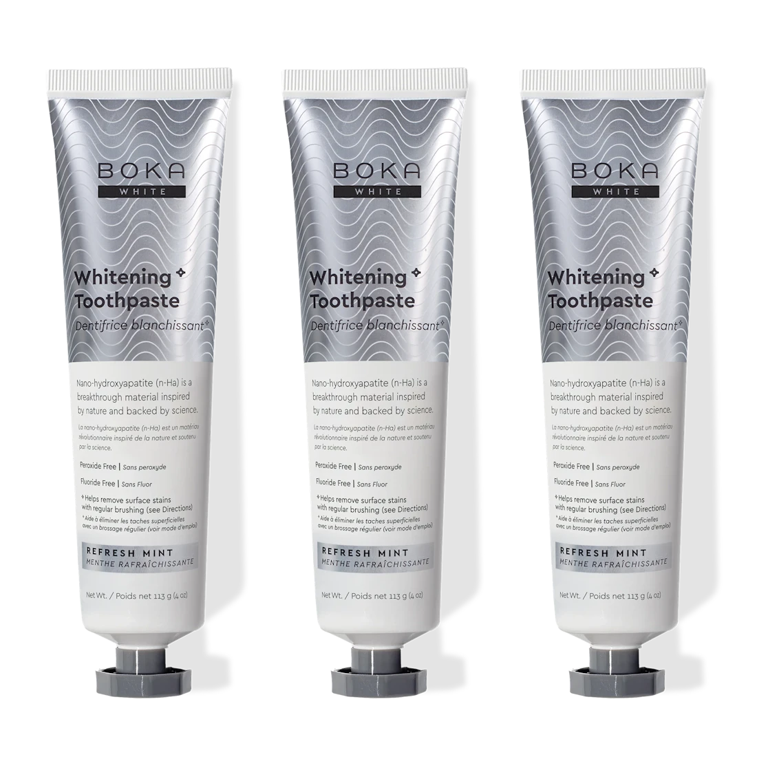 Three tubes of Boka Whitening Toothpaste on a white background