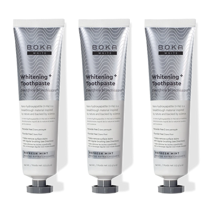 Three tubes of Boka Whitening Toothpaste on a white background
