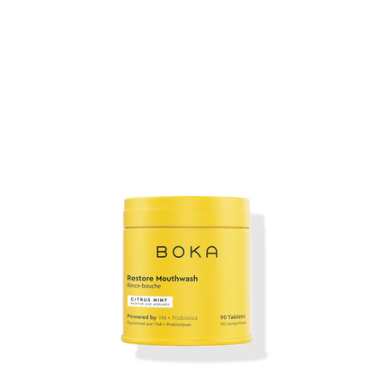 Yellow container of Boka Restore Mouthwash on a white background