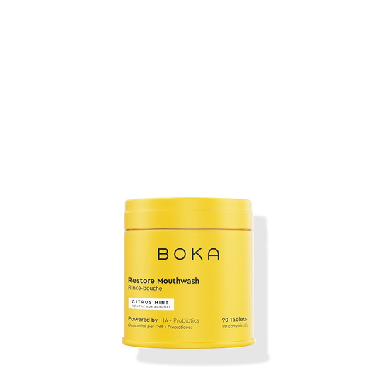Yellow container of Boka Restore Mouthwash on a white background