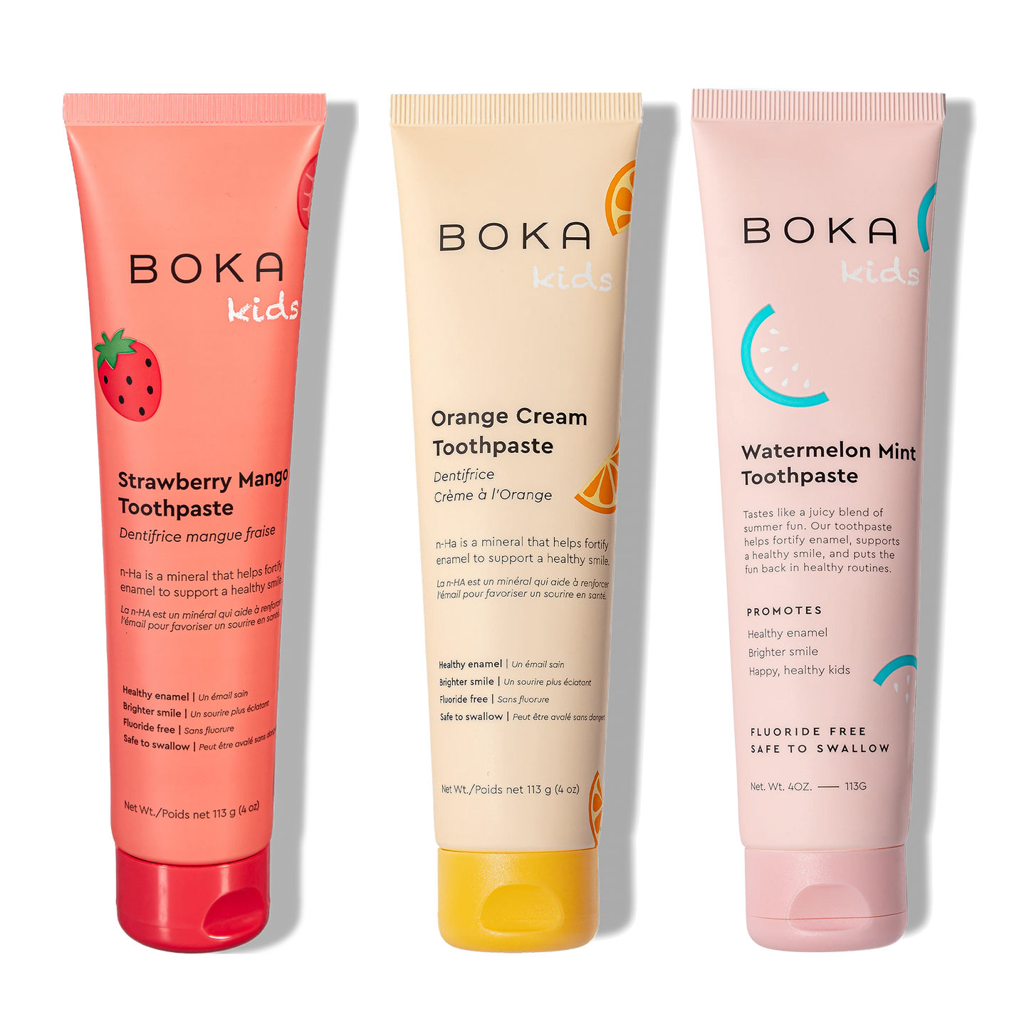 Three tubes of Boka toothpaste with different flavors on a white background
