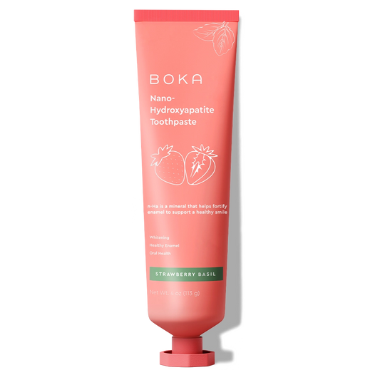 A pink tube of Strawberry Basil n-Ha Toothpaste, fluoride-free, for healthy smiles.
