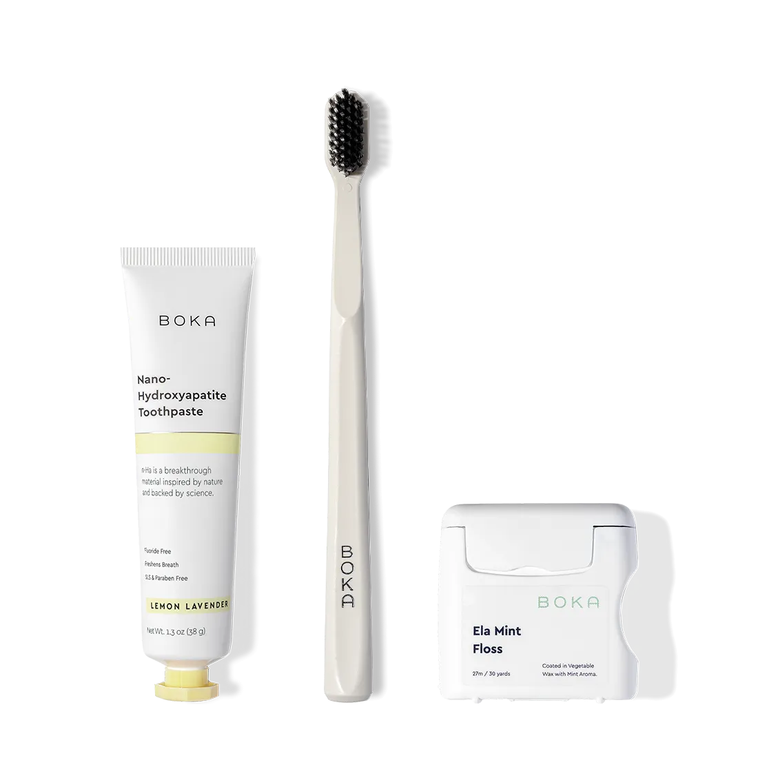 The Travel Kit, featuring Boka toothpaste, charcoal bristle brush, and floss on display.