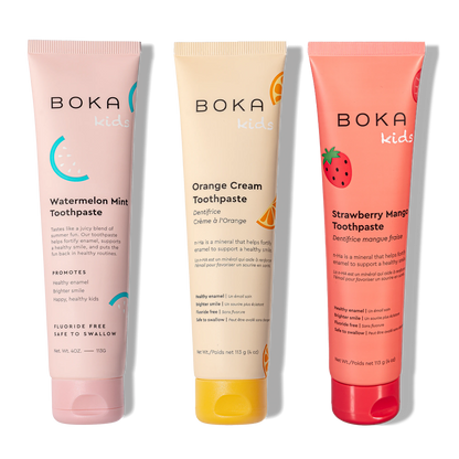 Three tubes of Boka toothpaste in different flavors on a white background
