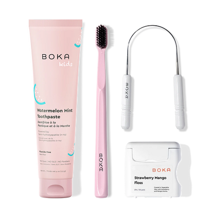 Boka dental care products including toothpaste, toothbrush, Tongue Scraper and floss on a white background