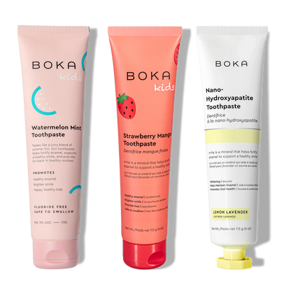 Three Boka toothpaste tubes in different flavors on a white background