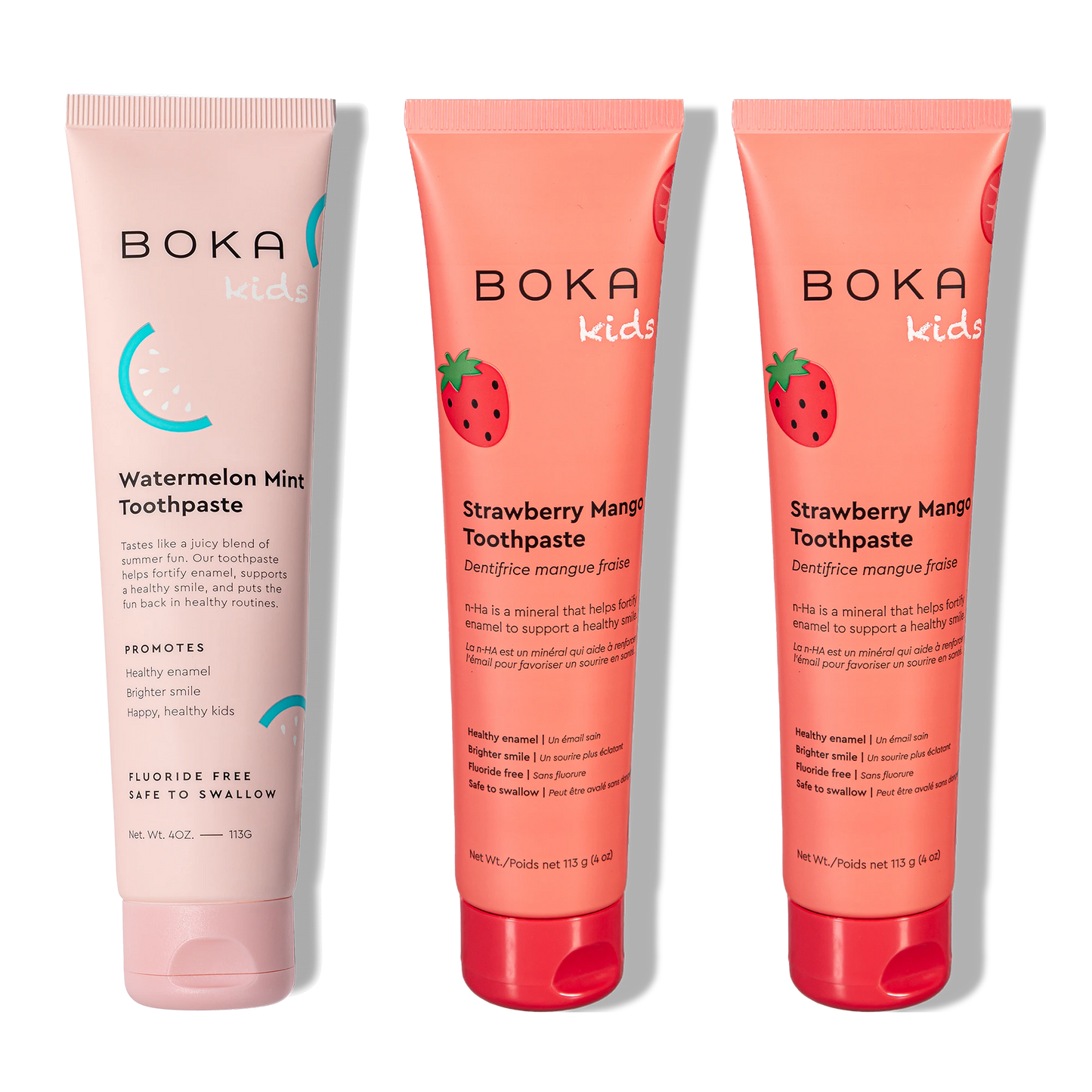 Three tubes of Boka Kids toothpaste, two in strawberry mango flavor and one in watermelon mint flavor, on a white background.