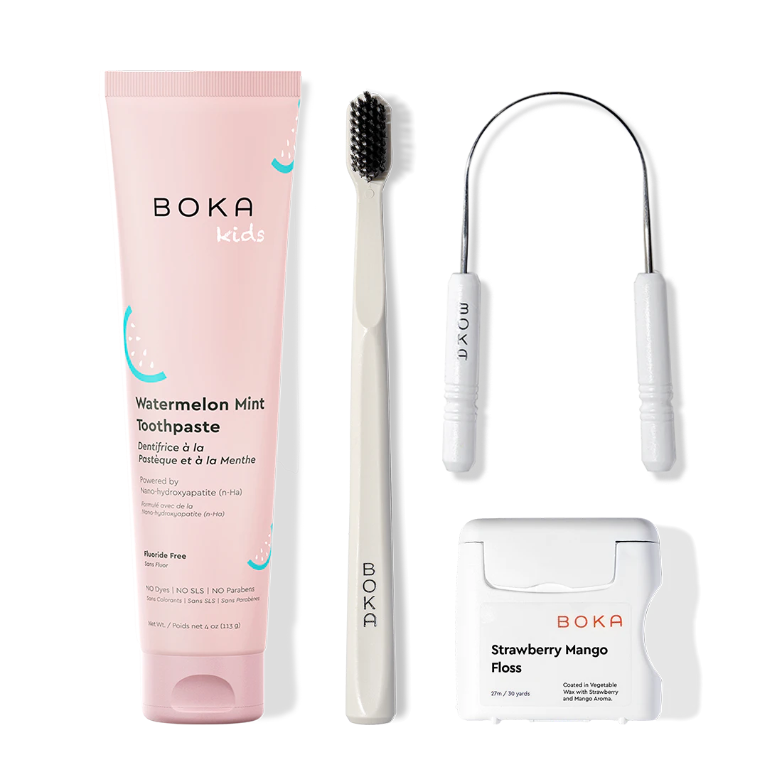 Boka dental care products including toothpaste, toothbrush, Tongue Scraper and floss on a white background