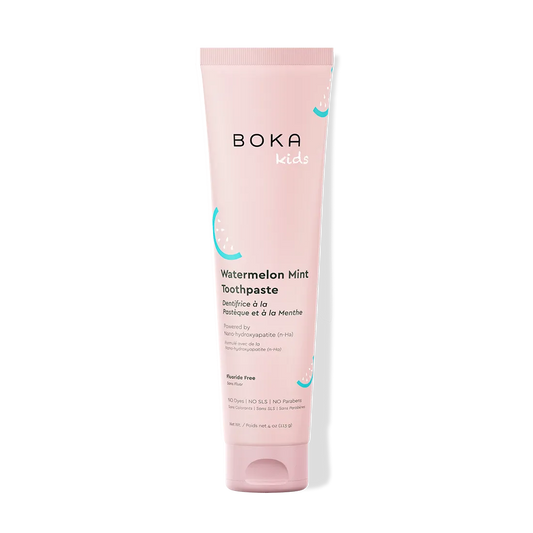 Pink tube of Boka Kids Watermelon Mint Toothpaste on a white background