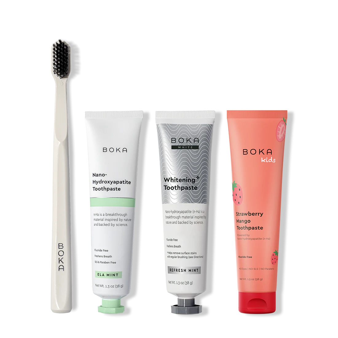 Collection of Boka toothpaste and a toothbrush on a white background